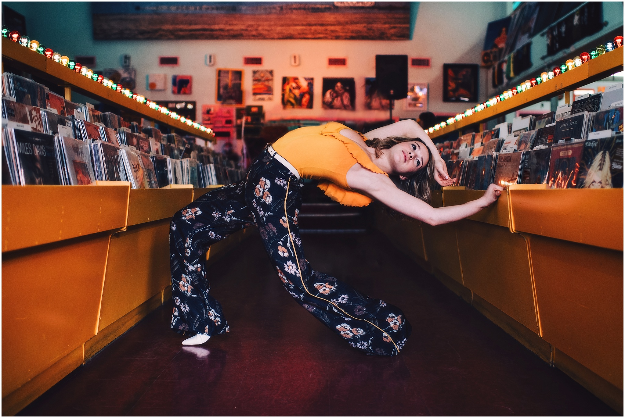 Ava Noble dancer in mustard top with printed pants in good records